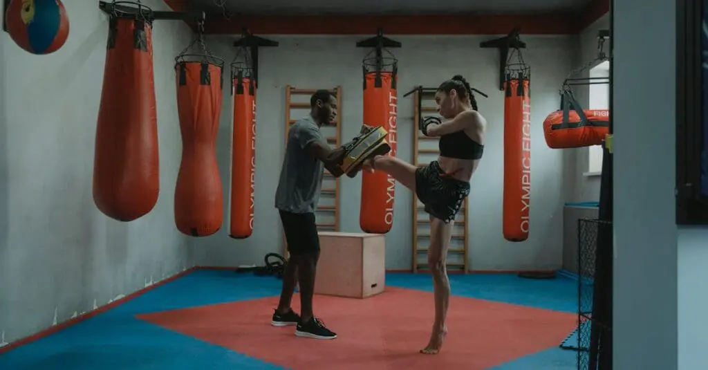 Adult student performing kick combinations with a coach during a martial arts training routine for adults