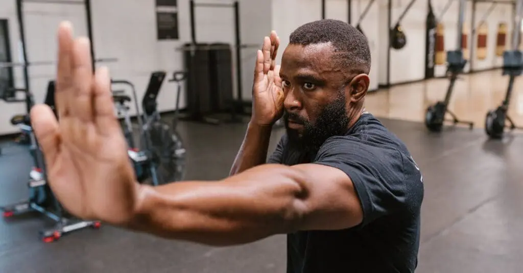Adult martial artist working on defensive movements during a martial arts training routine for adults