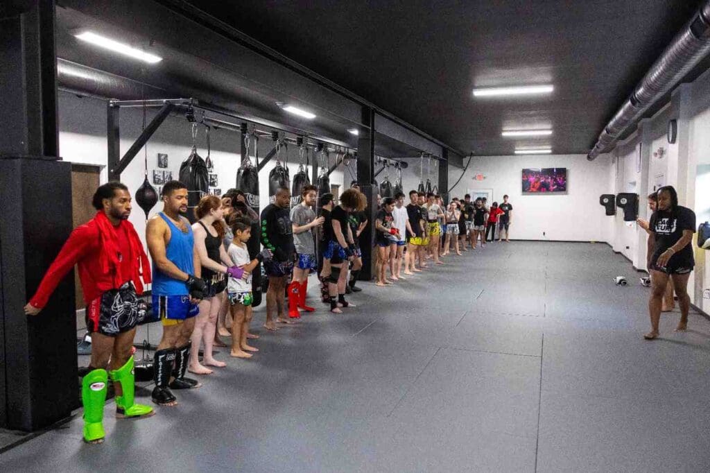 Students listening to instructor safety guidelines during class, demonstrating kids martial arts safety in Garwood, NJ.
