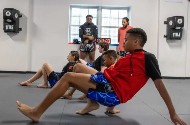 Teens shifting weight and improving balance while developing teens martial arts body awareness and control during training.